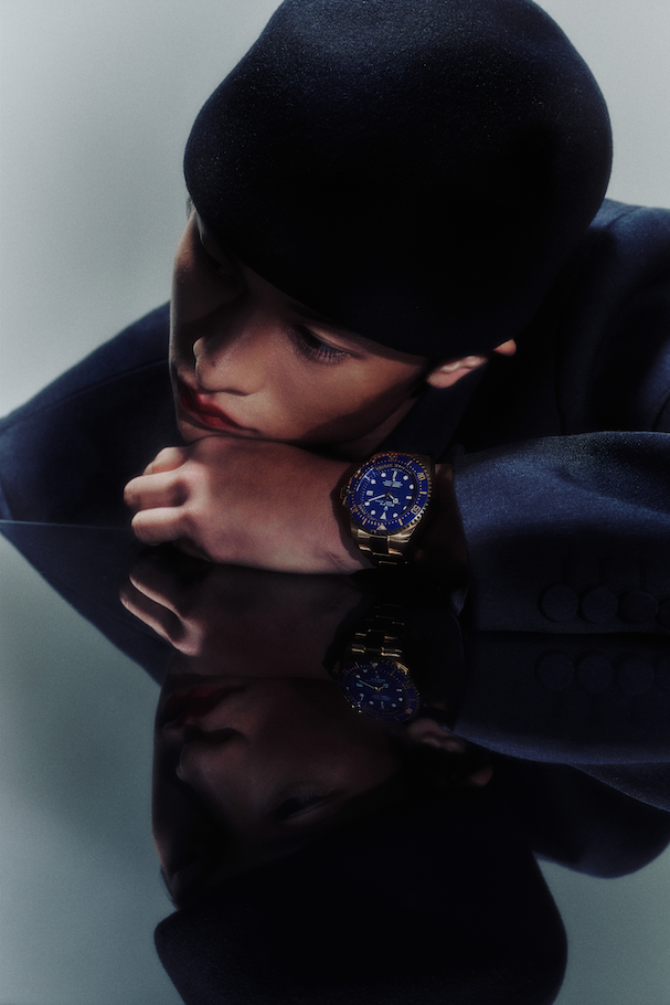 Deepsea Oyster in yellow gold _ Rolex; Grey wool coat _ Gucci