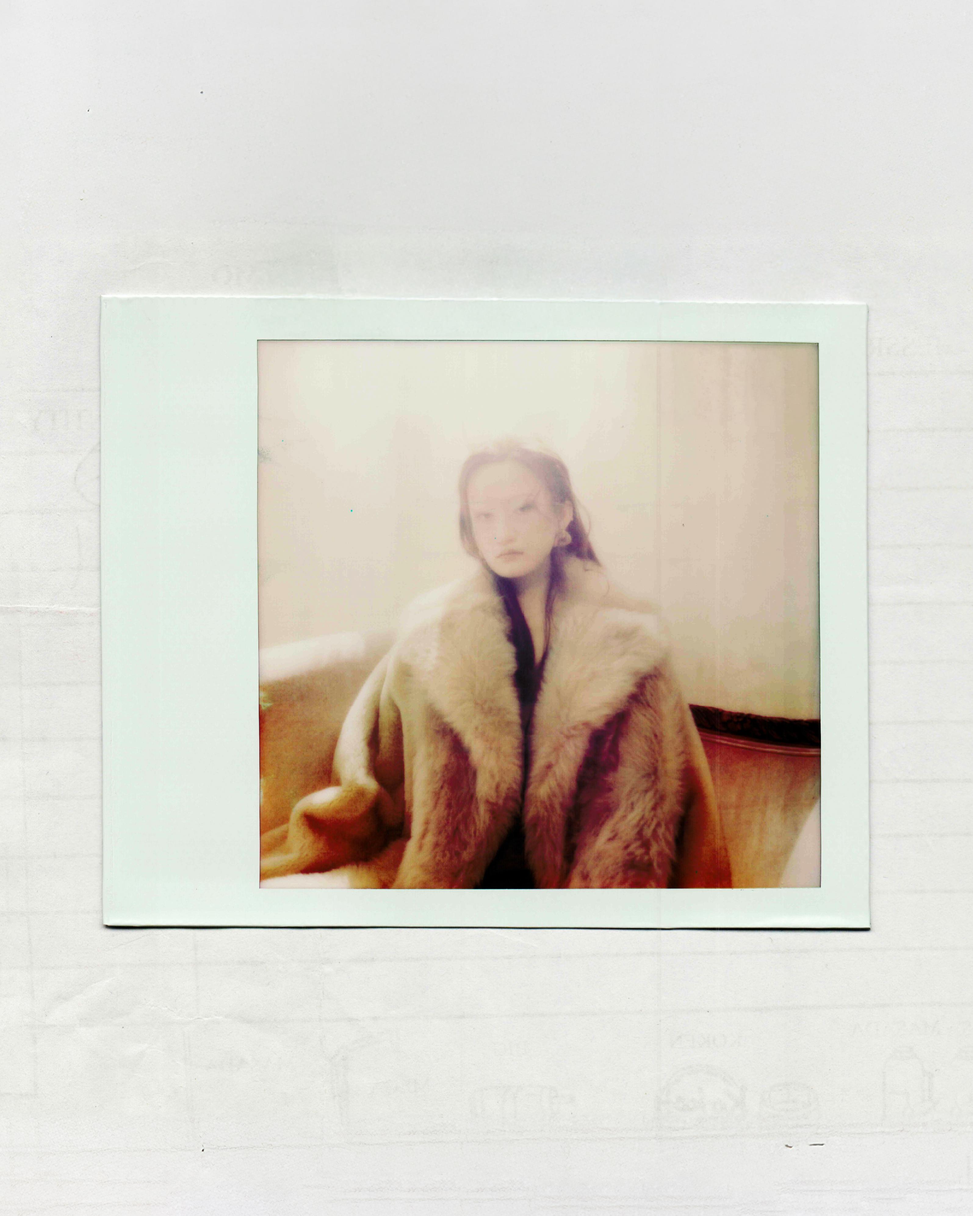 Fur coat and gold earrings _ Fendi