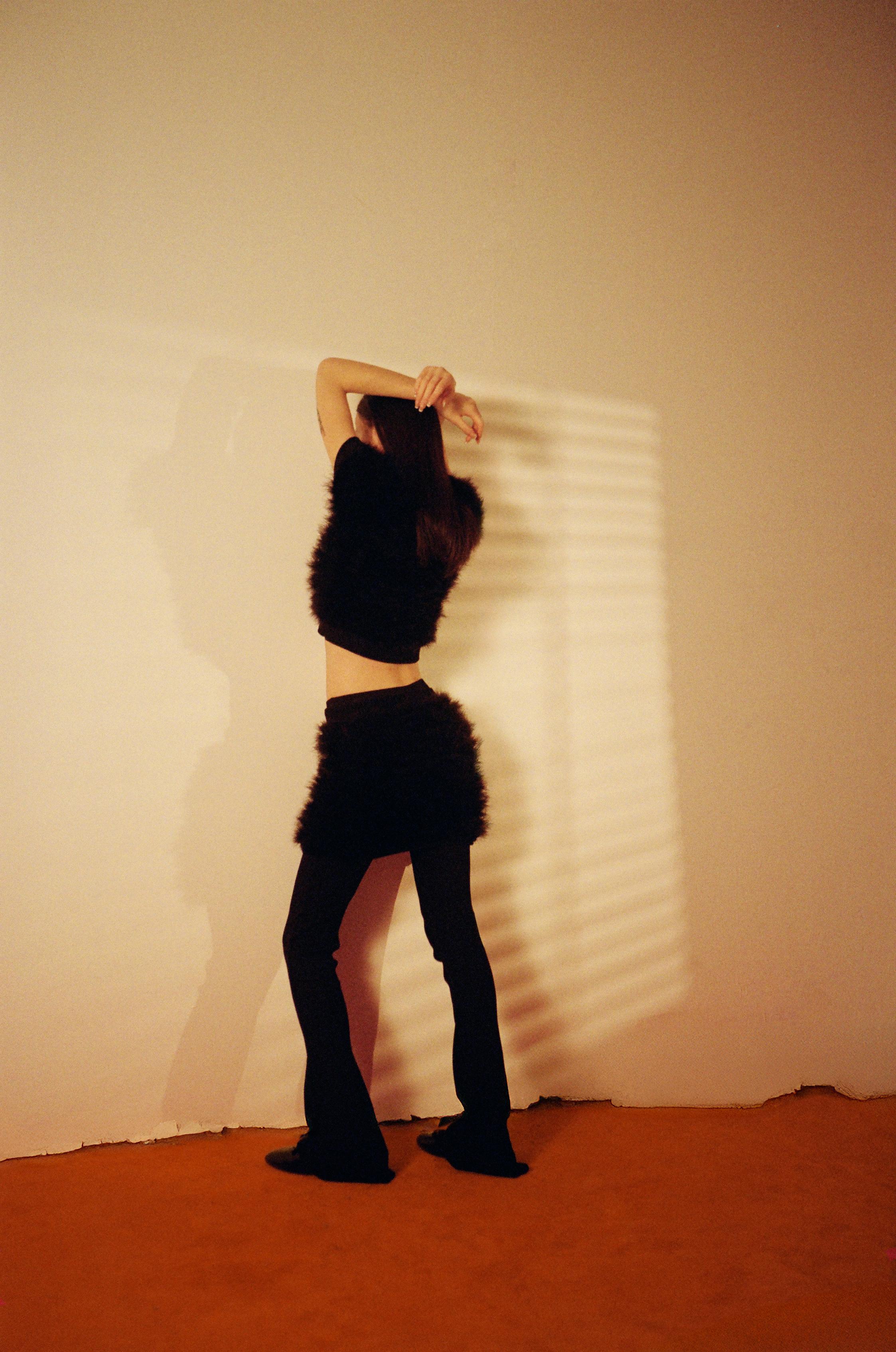 Black sweater, skirt, pants and shoes _ Prada