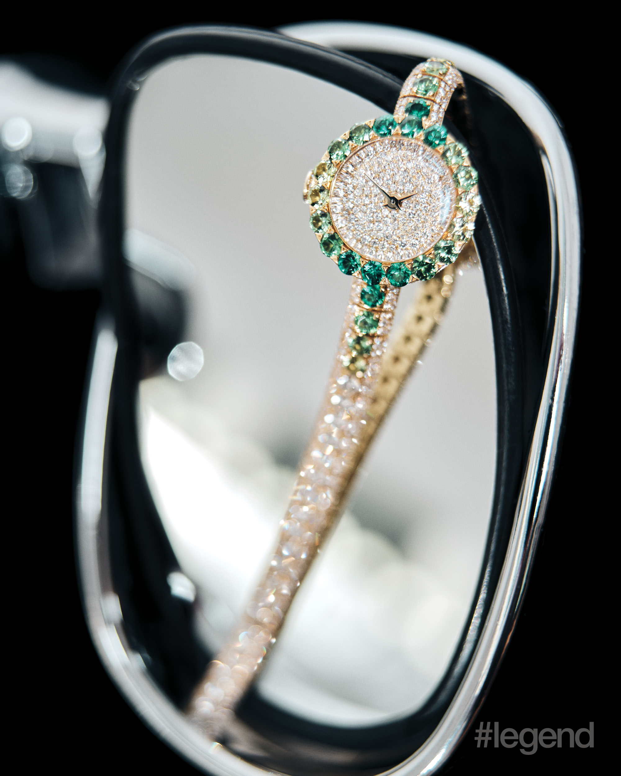 La D de Dior Précieuse watch in yellow gold with emeralds, tsavorites, peridots and diamonds _ Dior
