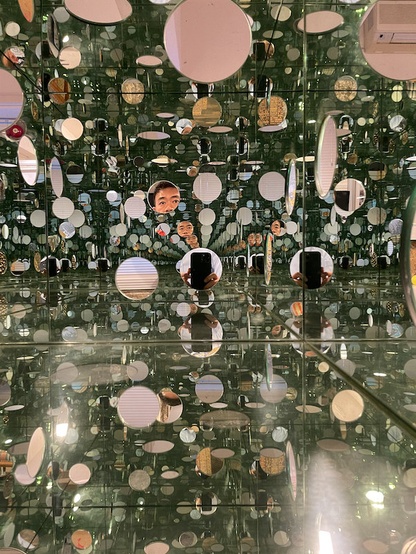 Collector Alan Lau captures a self-portrait in one of Japanese artist Yayoi Kusama’s mirrored installations.