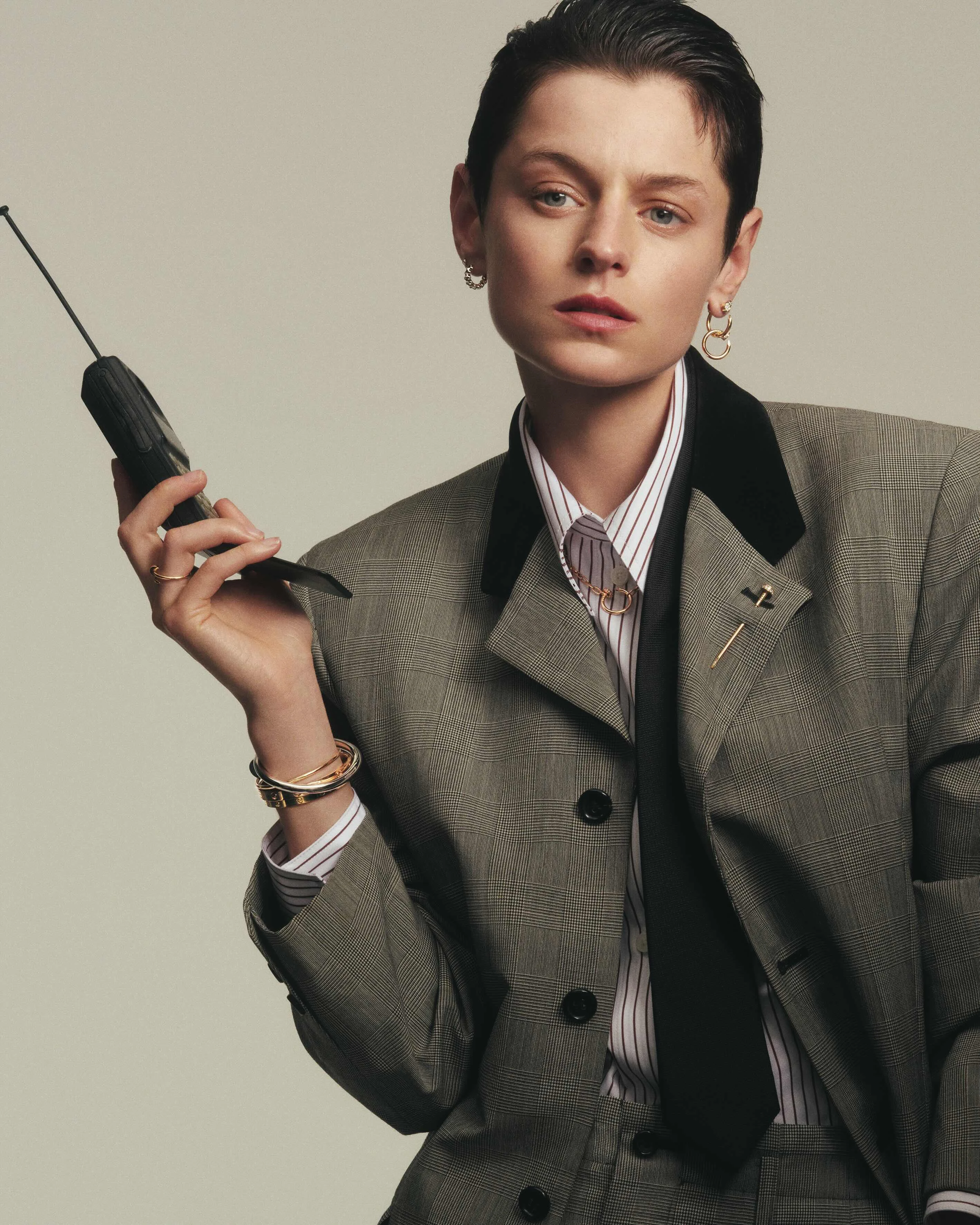 Tank Louis Cartier watch: Mini model; yellow gold; shiny black alligator leather strap. Juste un Clou earrings: Pink gold; diamonds. Juste un Clou tie pin: Pink gold; diamonds. Juste un Clou bracelet: Large model; white gold. LOVE bracelet: Classic model; yellow gold. LOVE bracelet: Medium model; yellow gold. Juste un Clou ring: Small model; yellow gold.