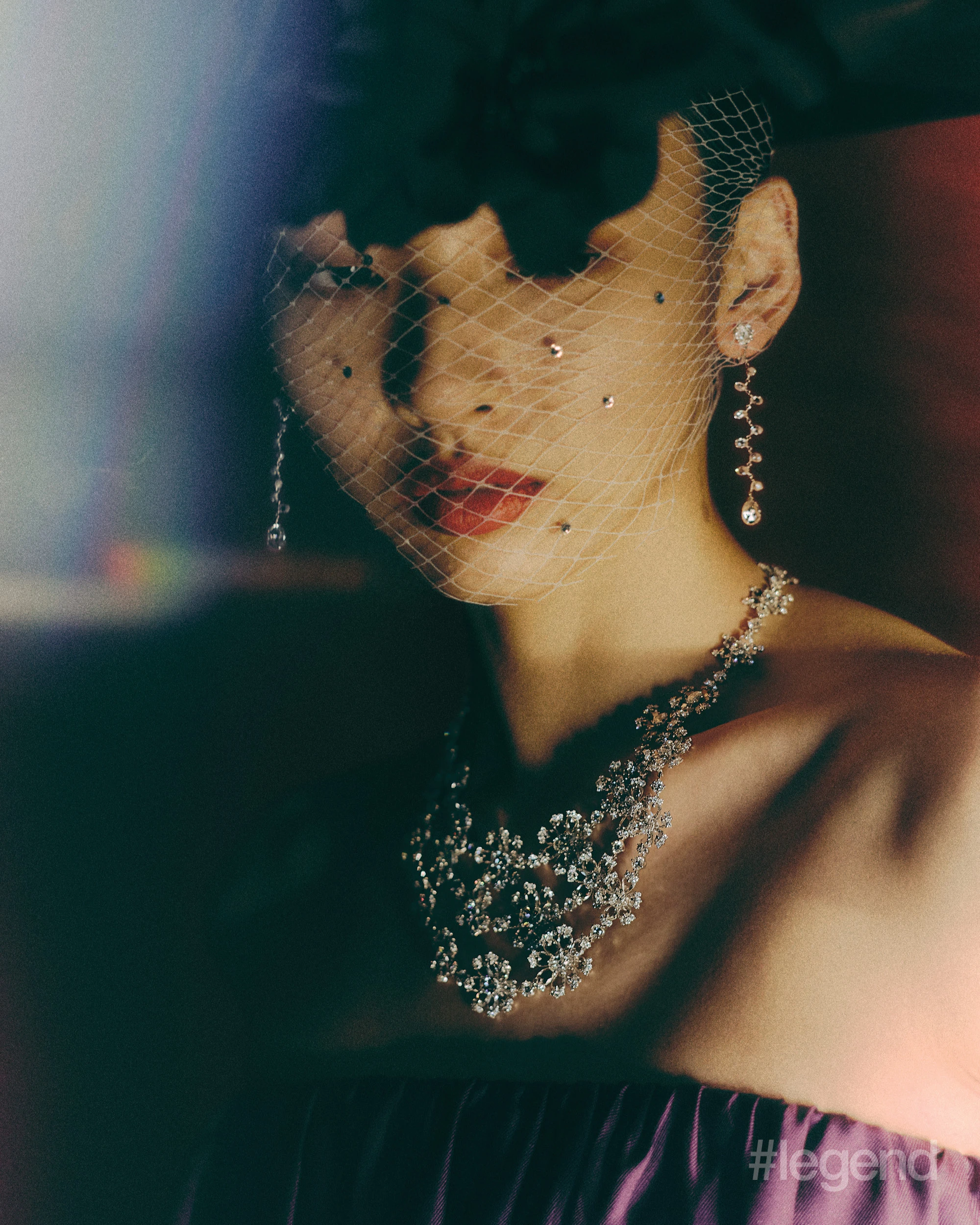 High Jewellery Collection necklace and earrings with diamonds _ Chopard; Purple pleated maxi dress _ Max Mara.