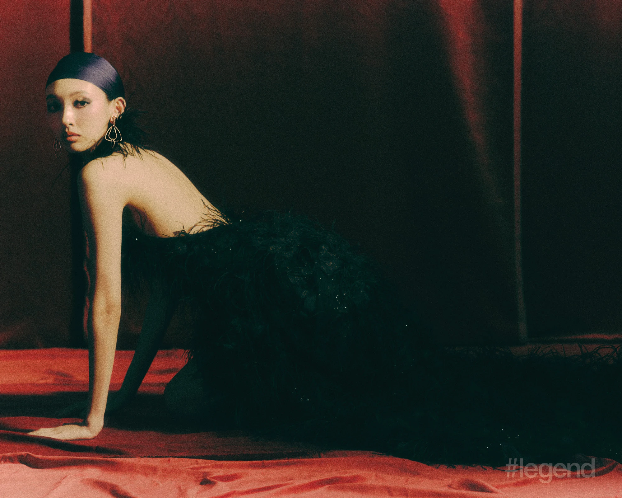 Ode to Milan Terrazza Duomo earrings in white gold with diamonds _ Pomellato; Black feathered gown _ Shiatzy Chen.