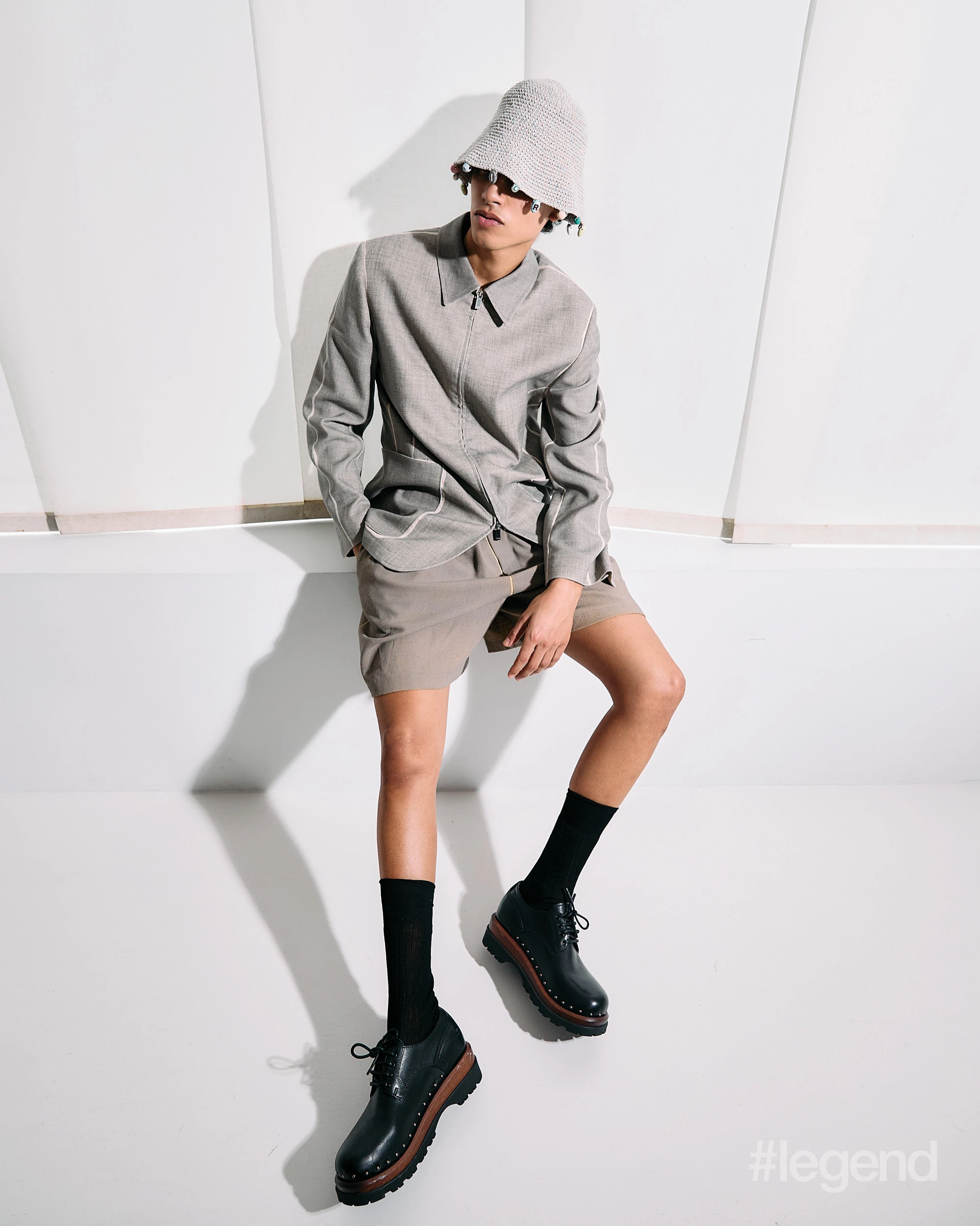 Grey top and knit hat, beige shorts and black shoes _ Dior