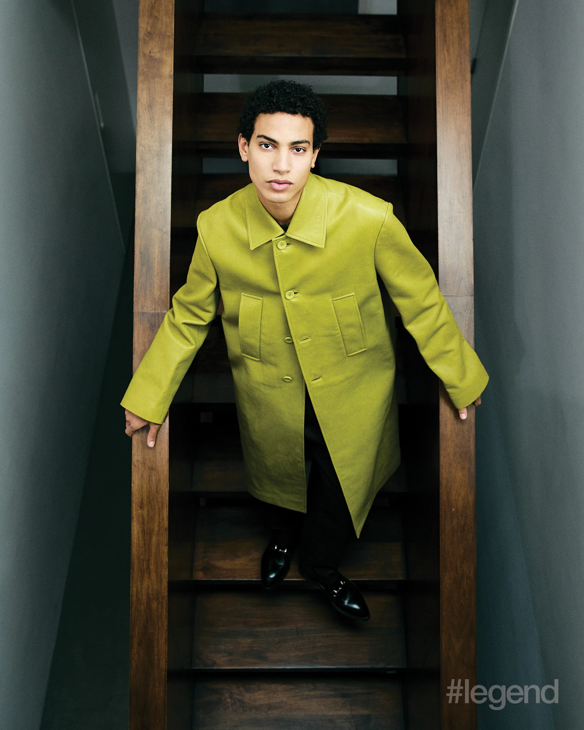 Green coat, and black top and shoes _ Gucci Brown blazer and beige trousers _ Feng Chen Wang; Black trousers _ Hermès