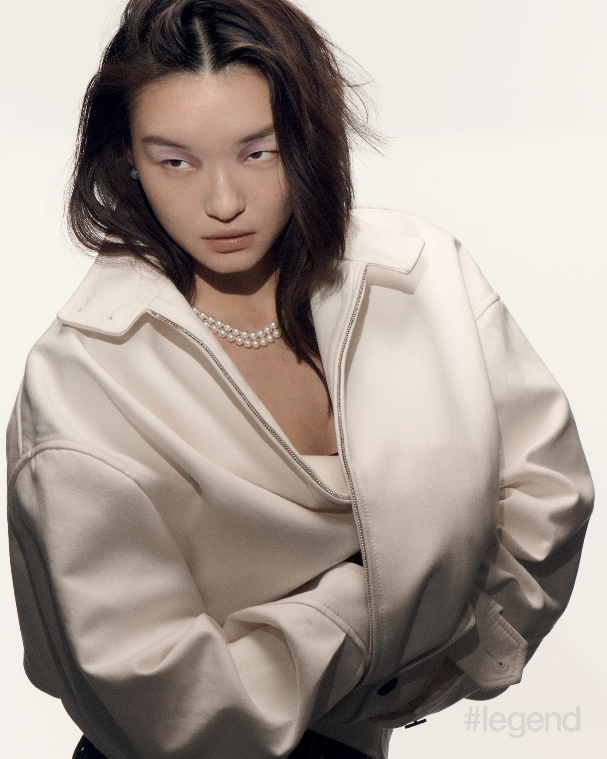 Earrings with white South Sea cultured pearls and double-strand necklace with Akoya cultured pearls _ Mikimoto; White jacket _ Gucci