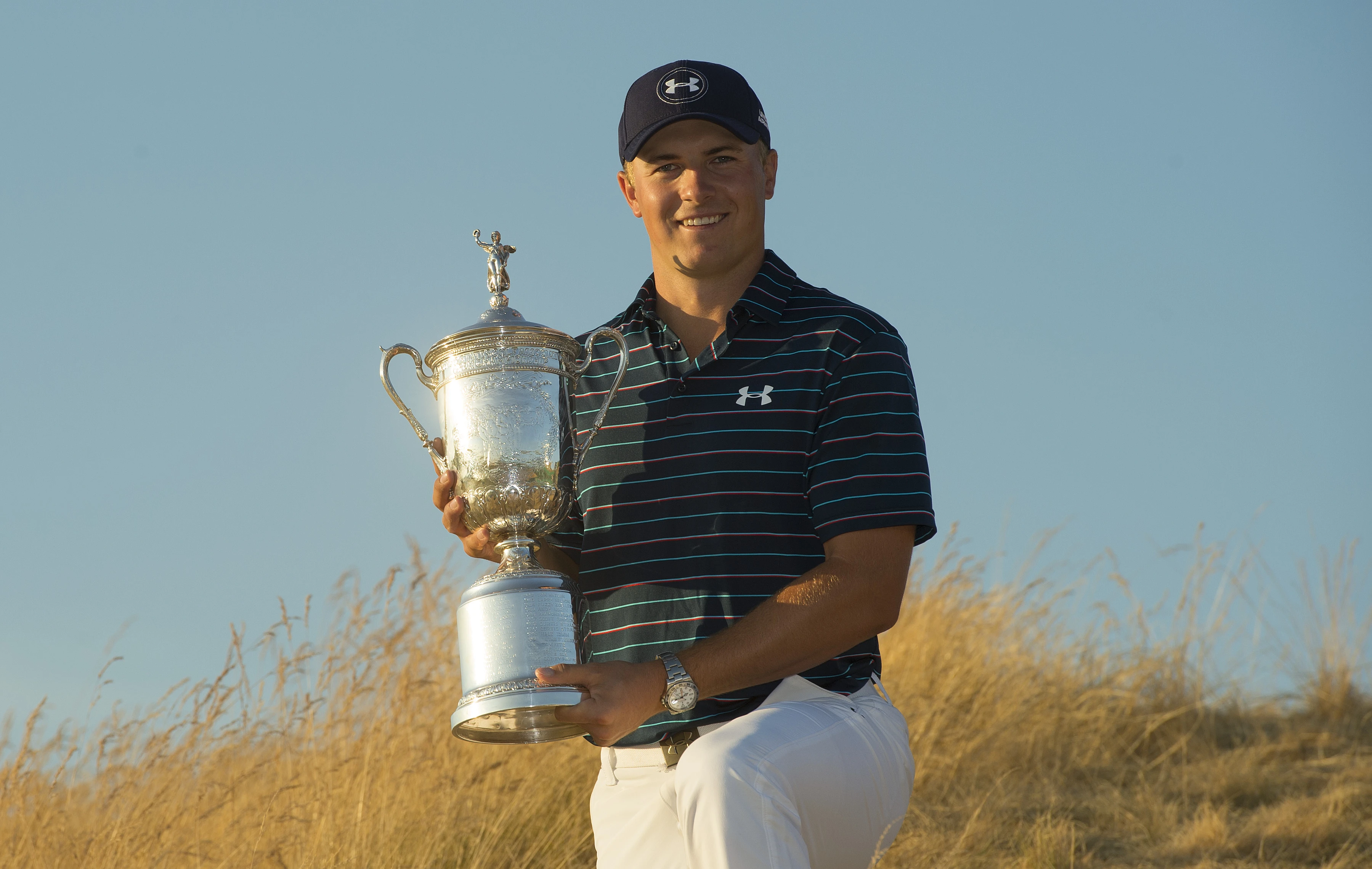 Jordan Spieth holding his trophy.