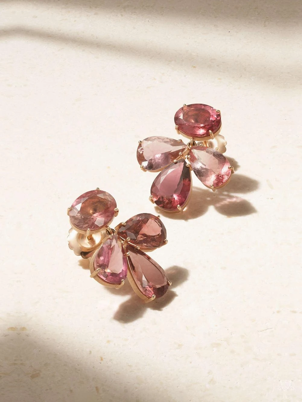 Ombre necklace in 18k gold with pink sapphires _ Shay; Brown maxi dress _ Leset; Earrings in 18k rose gold with pink tourmalines _ Irene Neuwirth from Net-A-Porter; Ivory shoulder bag _ The Row; Brown leather sandals _ Manolo Blahnik