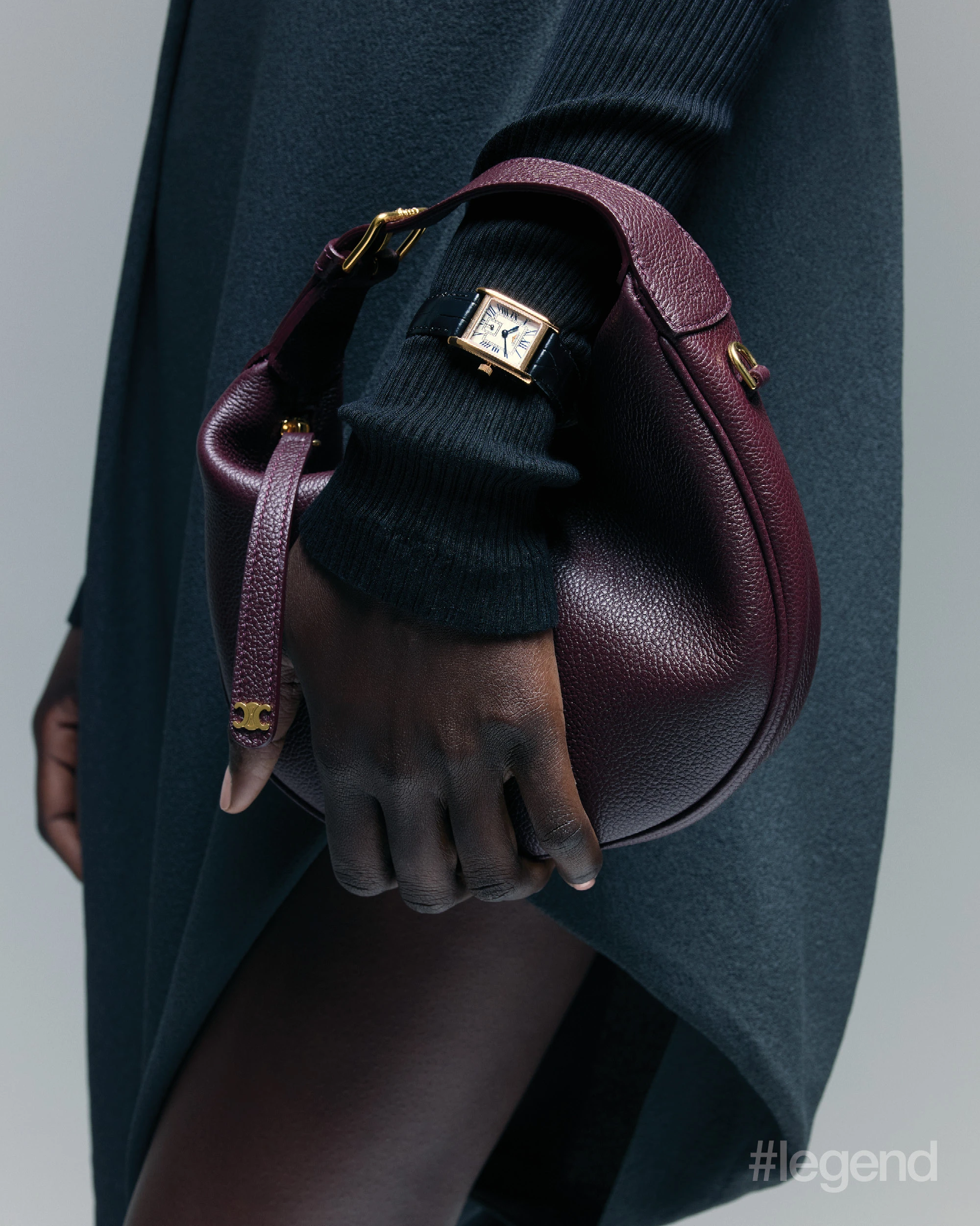 Black top _ Ferragamo; Grey skirt _ Louis Vuitton; Burgundy bag _ Celine; Longines DolceVita watch _ Longines