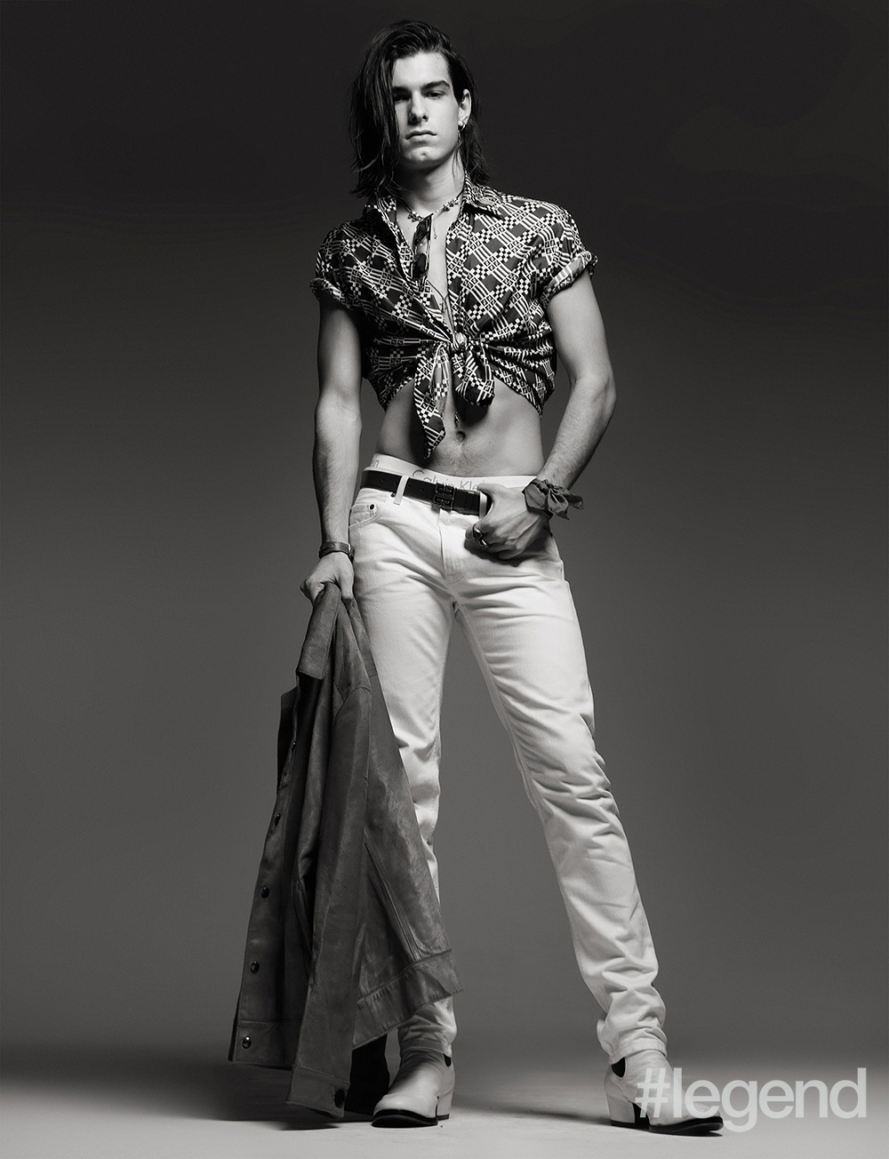 Necklace: Dior Homme; Sunglasses: Ermenegildo Zegna; Shirt: Fendi; Underwear: Calvin Klein Underwear; Jeans: Berluti; Pocket square (worn as bracelet) by Etro; Rings, earrings, belt and boots: Givenchy; Jacket: Salvatore Ferragamo; Leather bracelet: Hermès