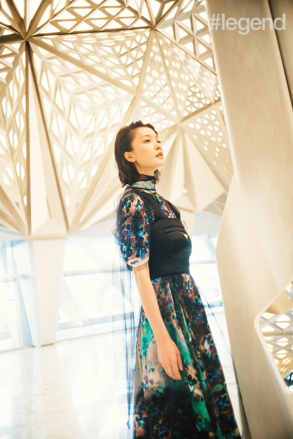 Green printed dress with chiffon overlay and black nylon bandeau top by Prada