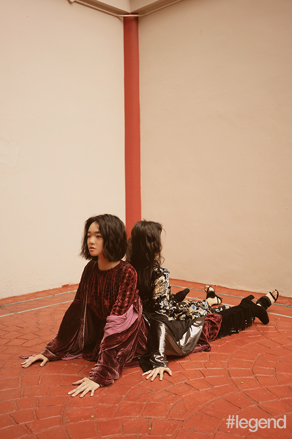 On Mei Yue [front] Burgundy velvet dress and black suede tasselled boots_Longchamp; Burgundy velvet dressing gown_Ralph Lauren / On Layla [back] Floral sequined dress_Tory Burch; Silver kimono_Norma Kamali, via matchesfashion.com; Black sandals_Longchamp