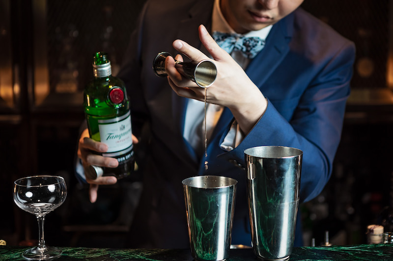 A mixologist at Frank's Library makes a drink (credit: The Forks & Spoons)