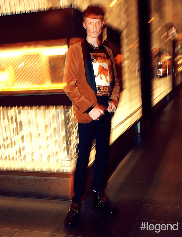 Jacket and trousers_Brunello Cucinelli; Sweatshirt, jewellery, and shoes_Versace