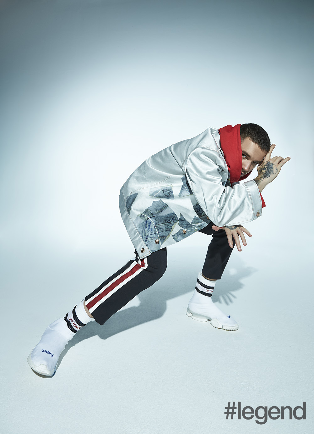 Jacket by Alex Mullins, hoodie by Raf Simons from Browns Fashion, trousers by Dolce & Gabbana and shoes by Vetements x Reebok