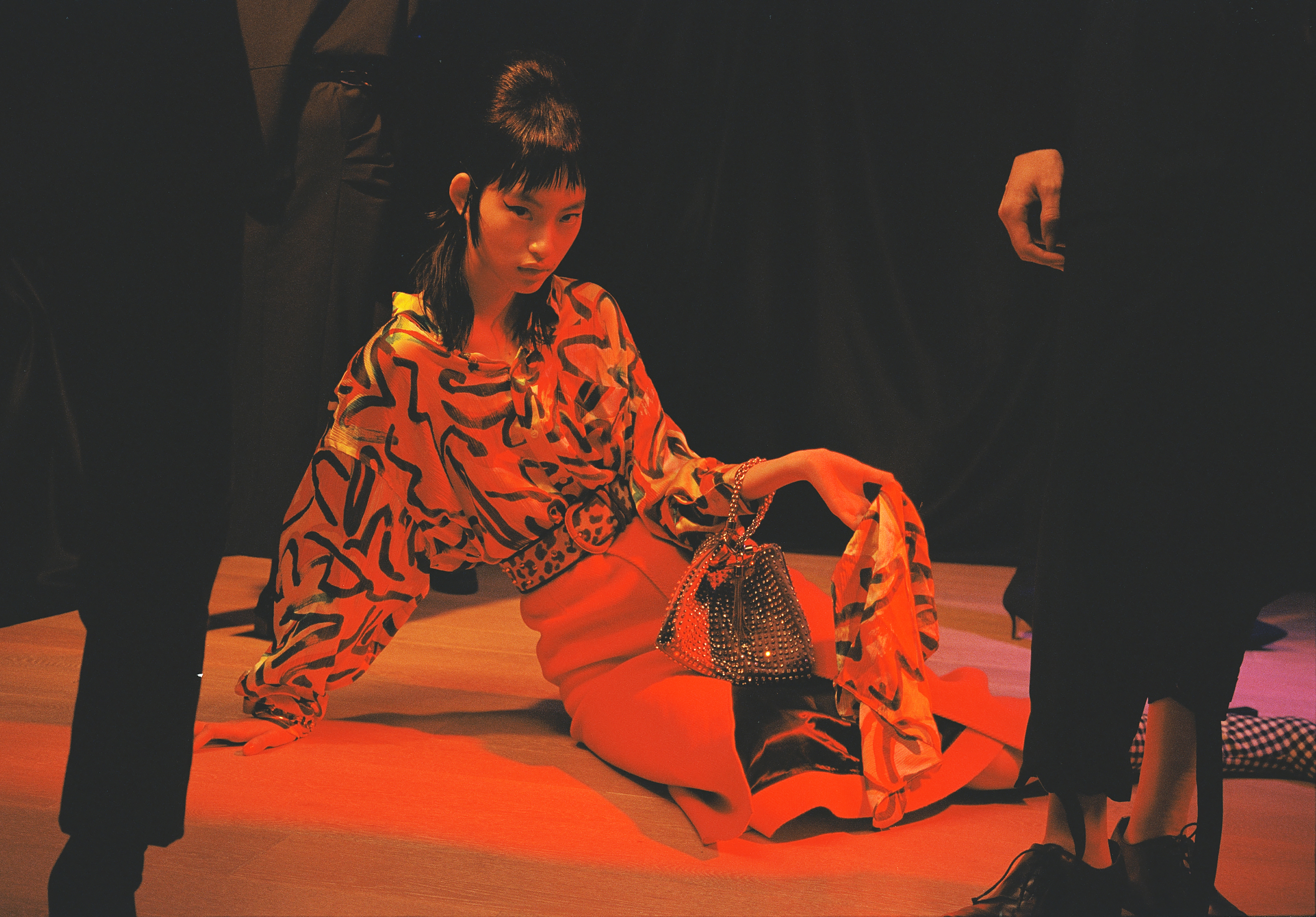 Printed top, skirt, bracelet, scarf and boots by Balenciaga; Bag with crystals by Jimmy Choo; Leopard-print belt is vintage Christian Dior available at OnceStyle.hk