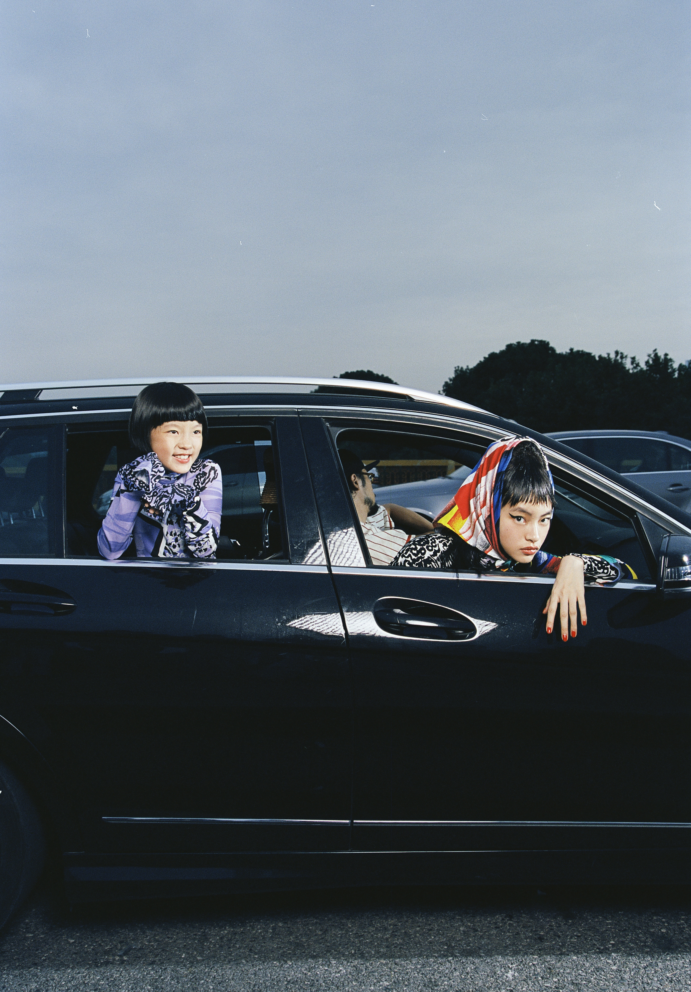 (Left) Purple printed top by Versace; (Right) Printed scarf and leopard-print top by Versace