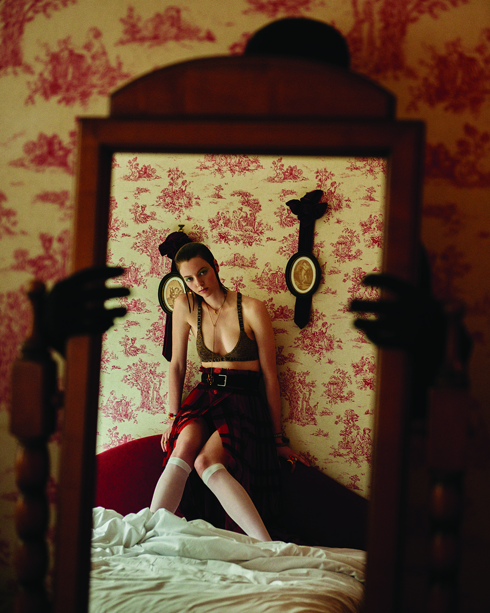 Brown bra, red skirt, and accessories from Dior