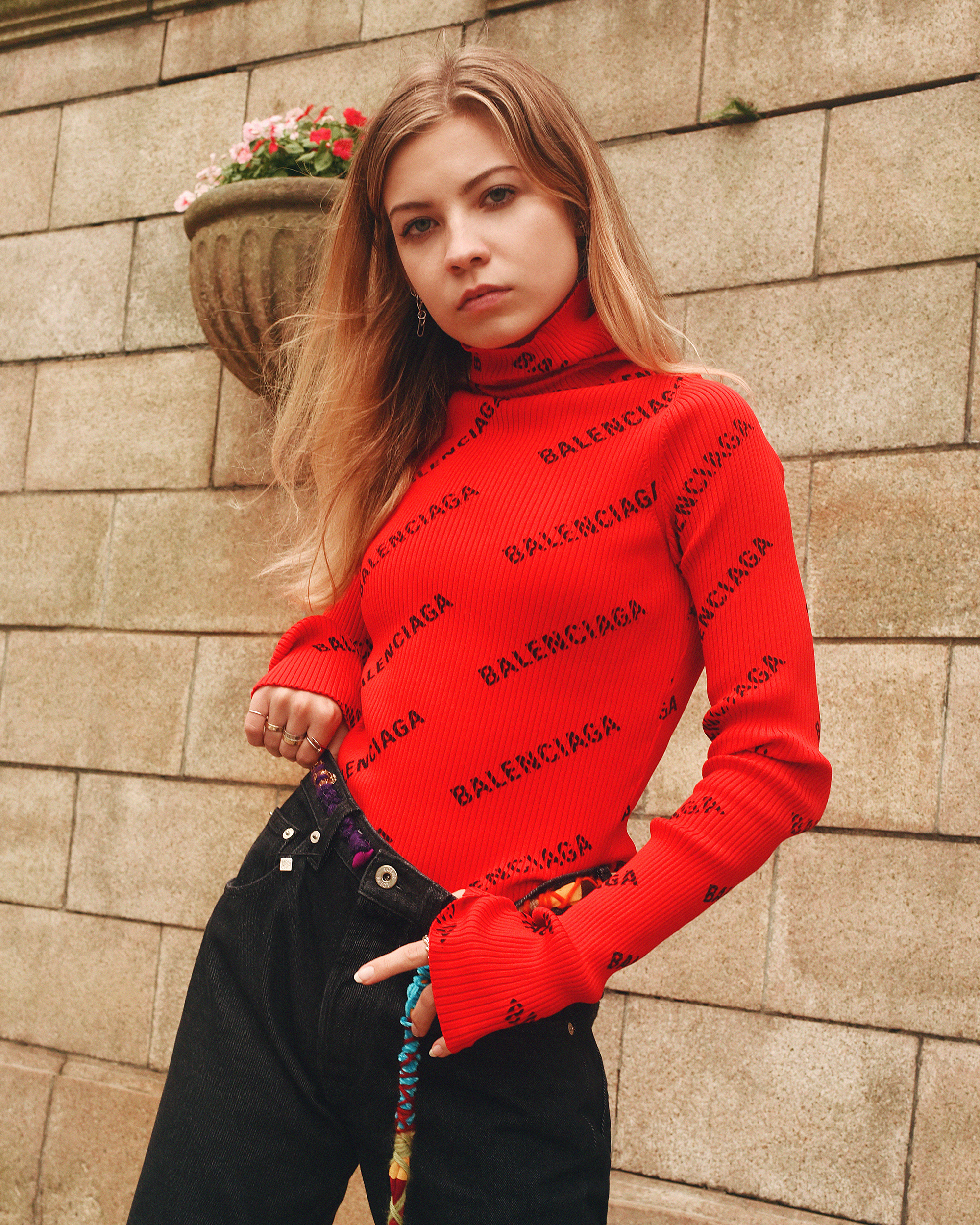 Balenciaga hooded turtleneck and Loewe jeans via Joyce HK
