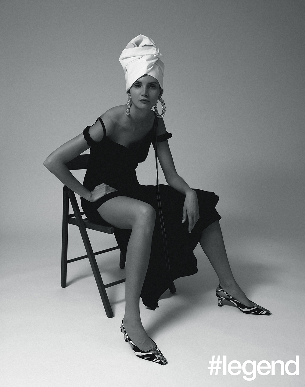 Black gown_Loewe; Silver oversized hoop earrings and zebra-print shoes_Tom Ford; Turban stylist's own