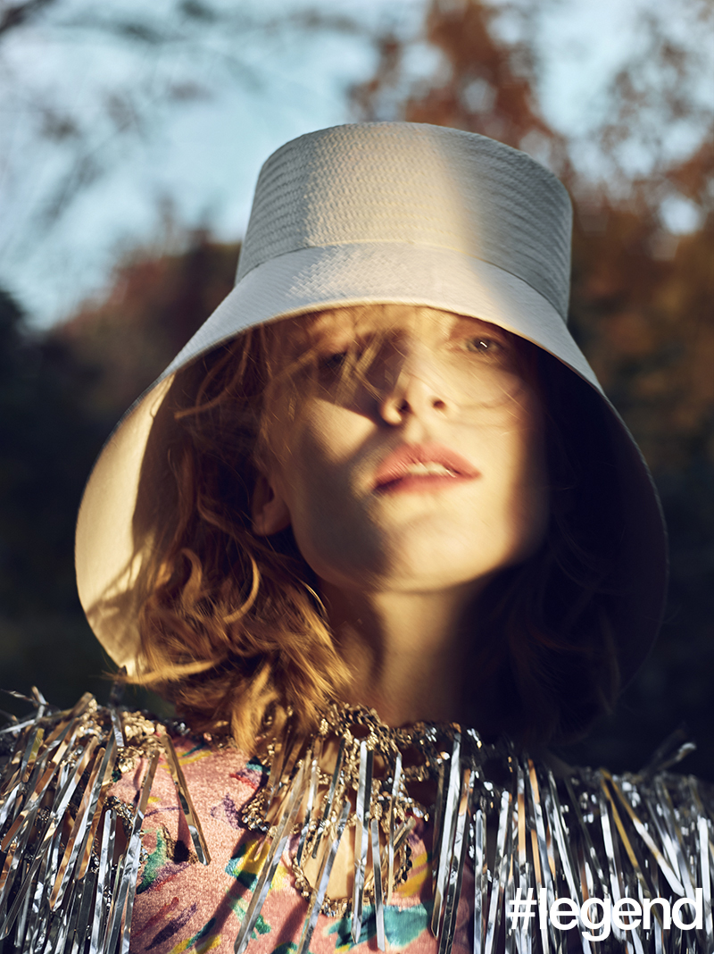 White woven straw hat and pink printed dress with silver tinsel _ Louis Vuitton