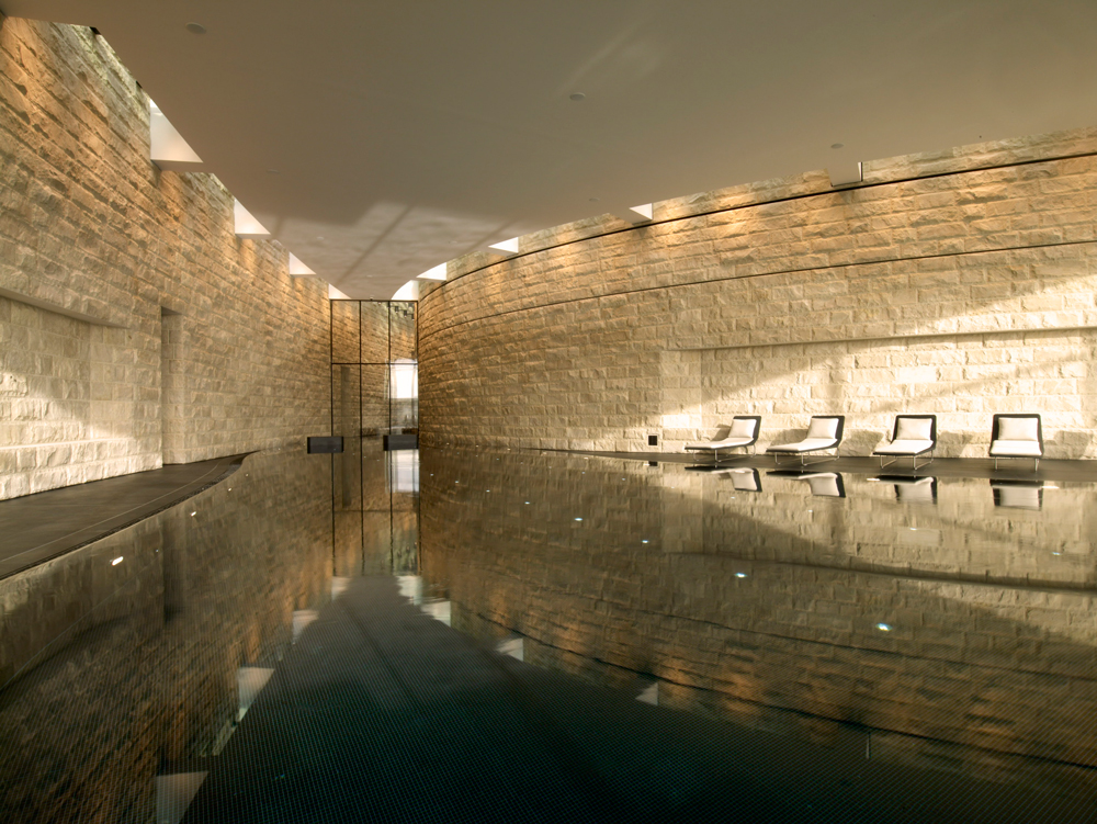 Swim laps in the sleek black-tiled pool