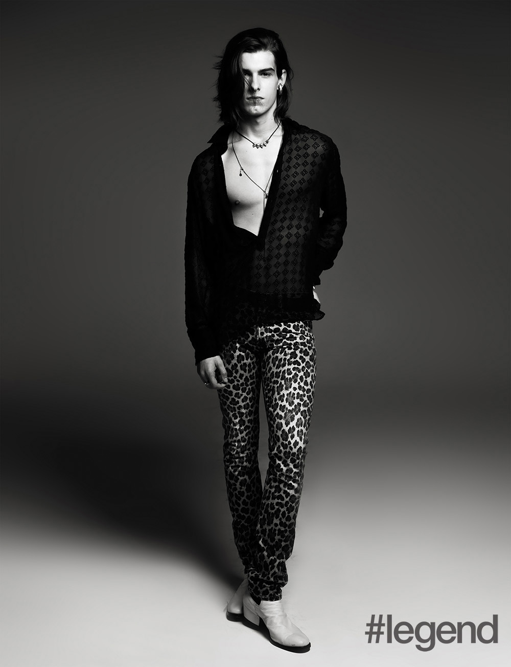 Earring: Gucci; Top, belt and long necklace: Givenchy; Short necklace: Dior Homme; Jeans: Tom Ford