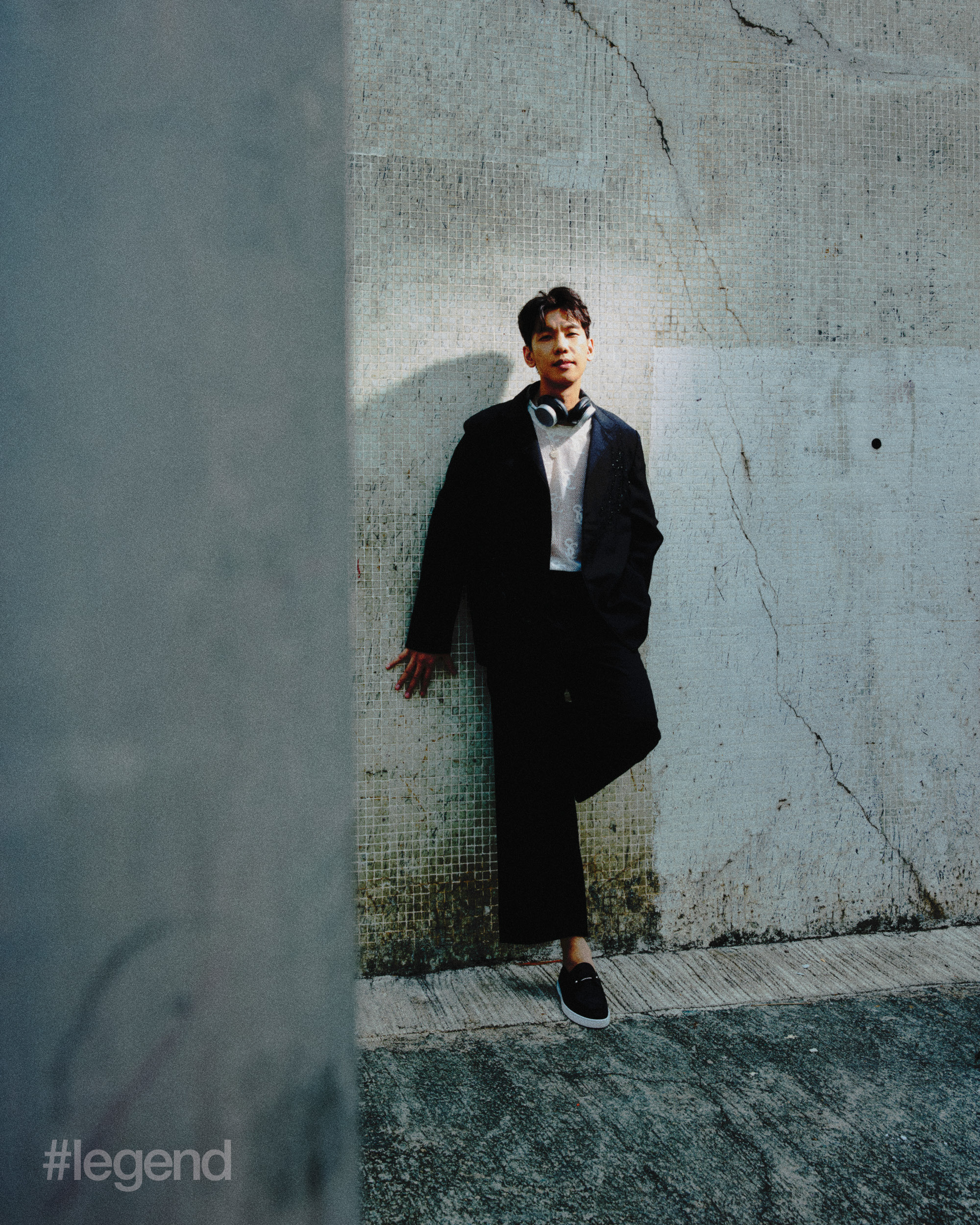 Dark grey oversized blazers with embroidered details; White see through knitted vest top; Black wide leg high waist trousers _ Shiatzy Chen Black chambeliboat flat shoes _ Christian Louboutin; Silver coins chain necklace with coins pendant _ The Future Rocks. Headphones: Bang & Olufsen Beoplay H100