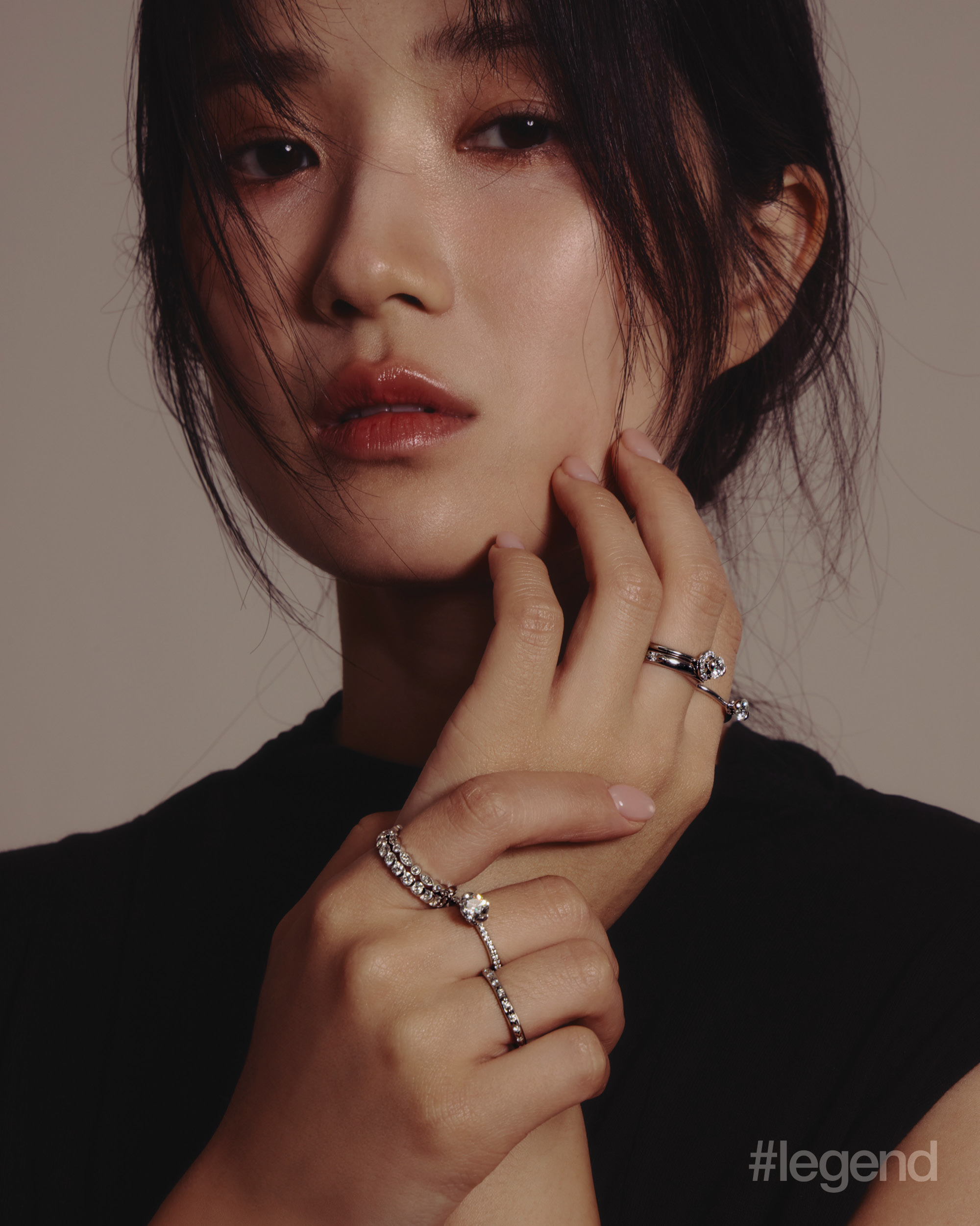 Black sleeveless dress _ Ponder.er; Bond Collection 2-prong Bond Rings in 18k white gold, and rings in 18k white gold with diamonds _ Chow Tai Fook