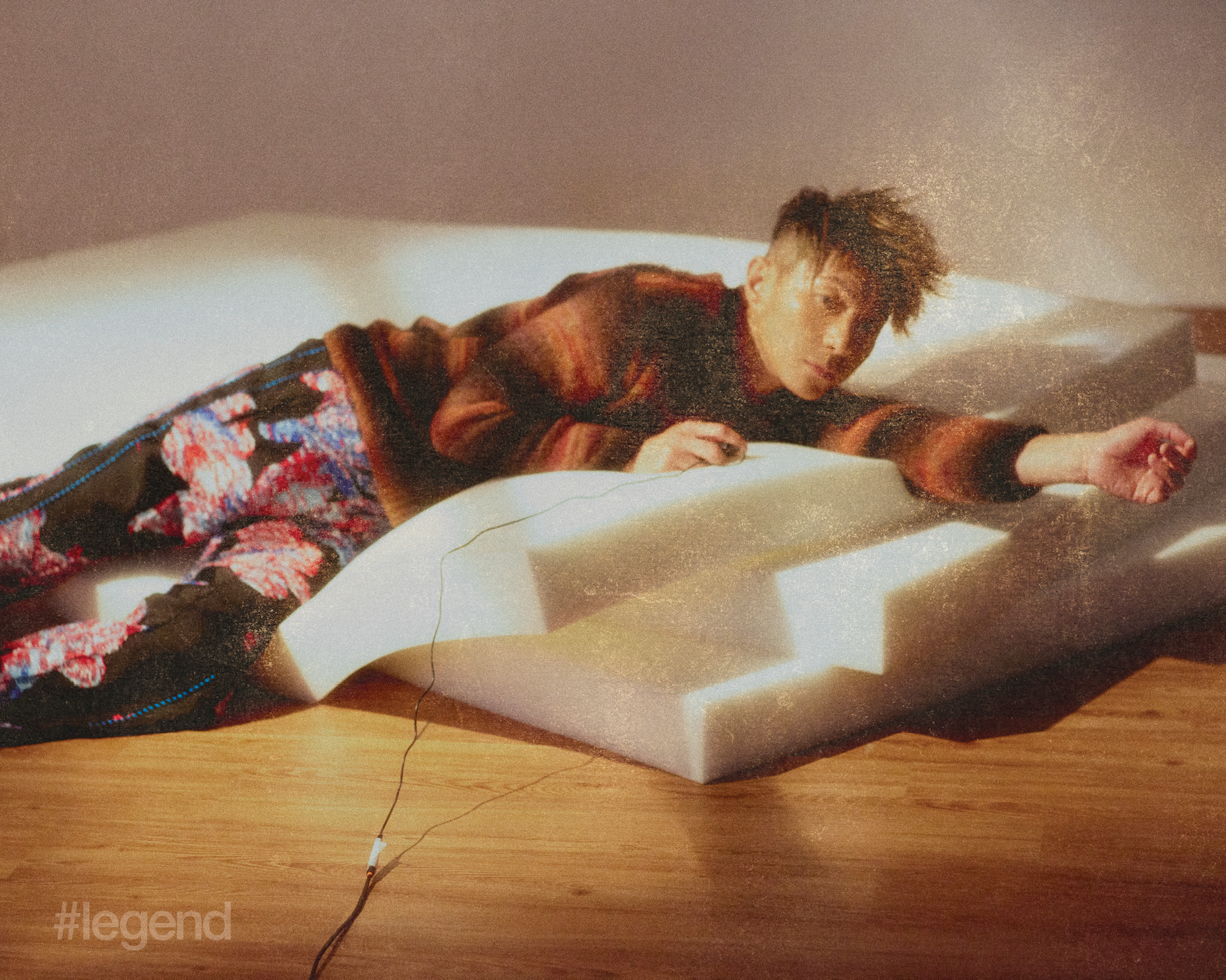 Orange sweater _ Kenzo; Floral trousers _ Taakk