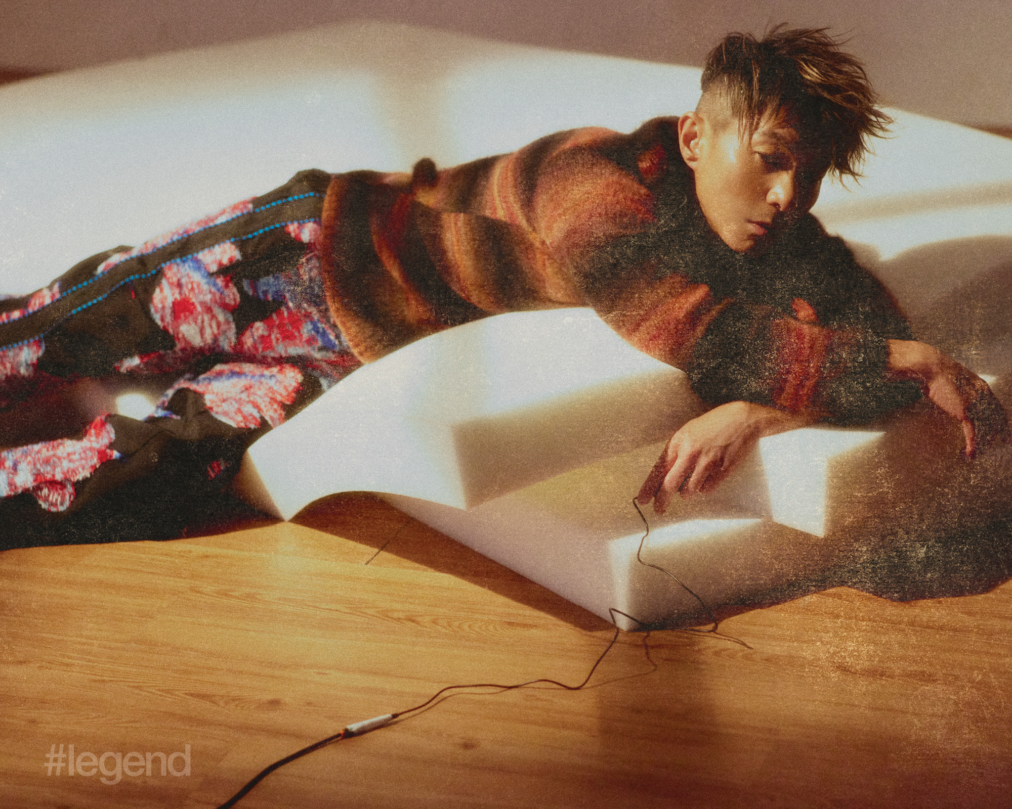 Orange sweater _ Kenzo; Floral trousers _ Taakk