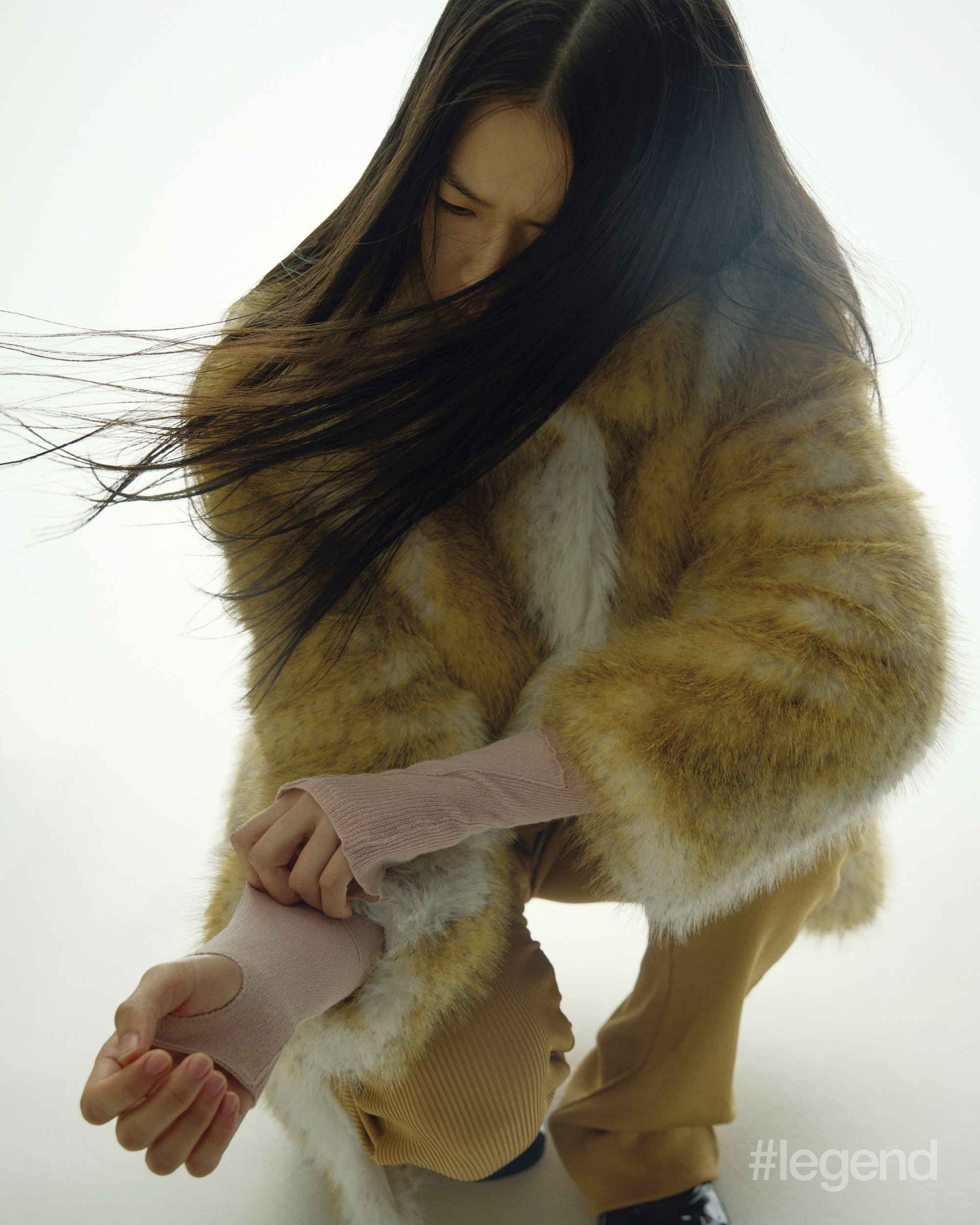 Brown faux fur coat and ribbed trousers _ Prada; Knit top _ Marc Jacobs; Black and white shoes _ Dear Frances