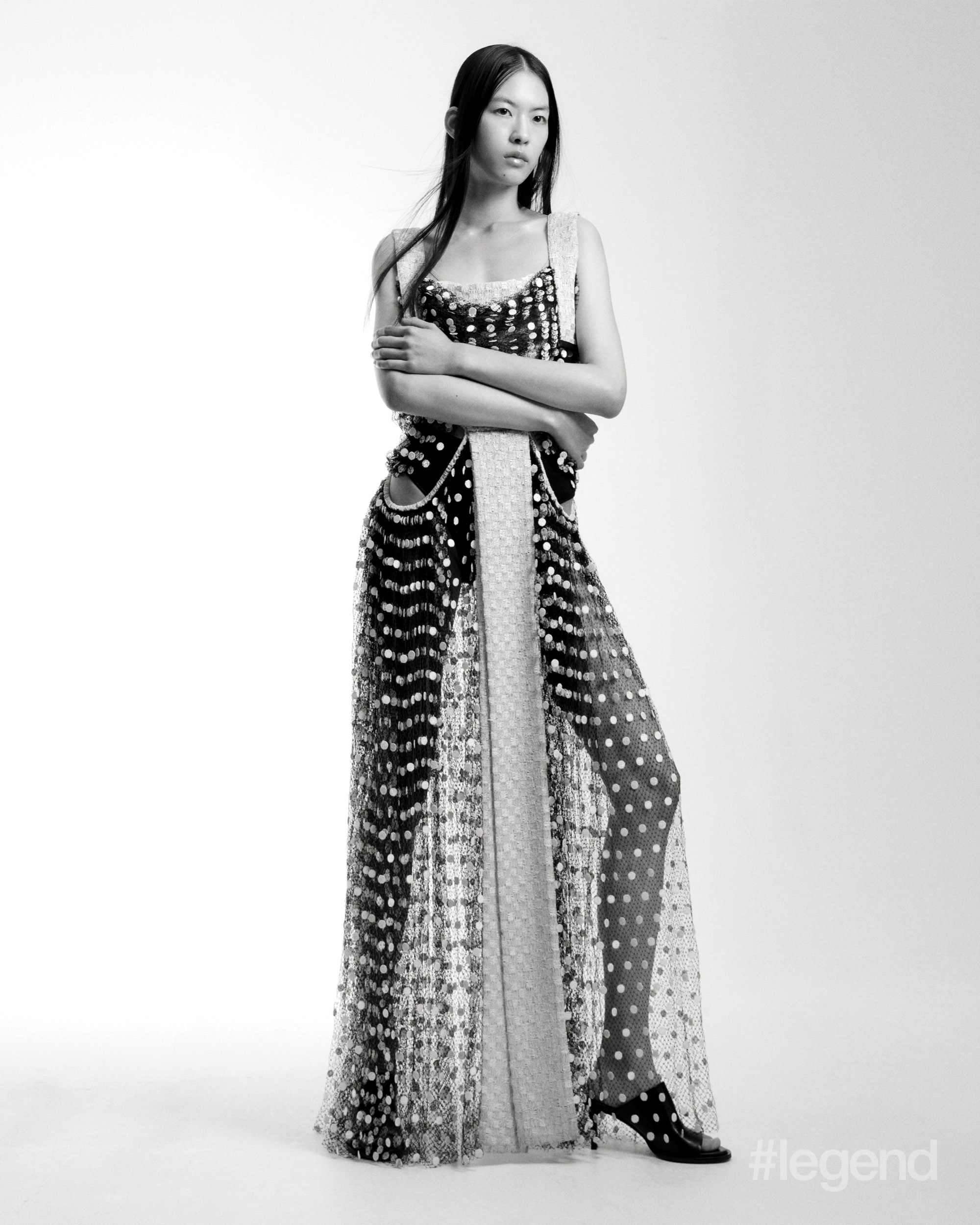 Black sheer polka dot dress _ Louis Vuitton; Black mules _ Tod’s