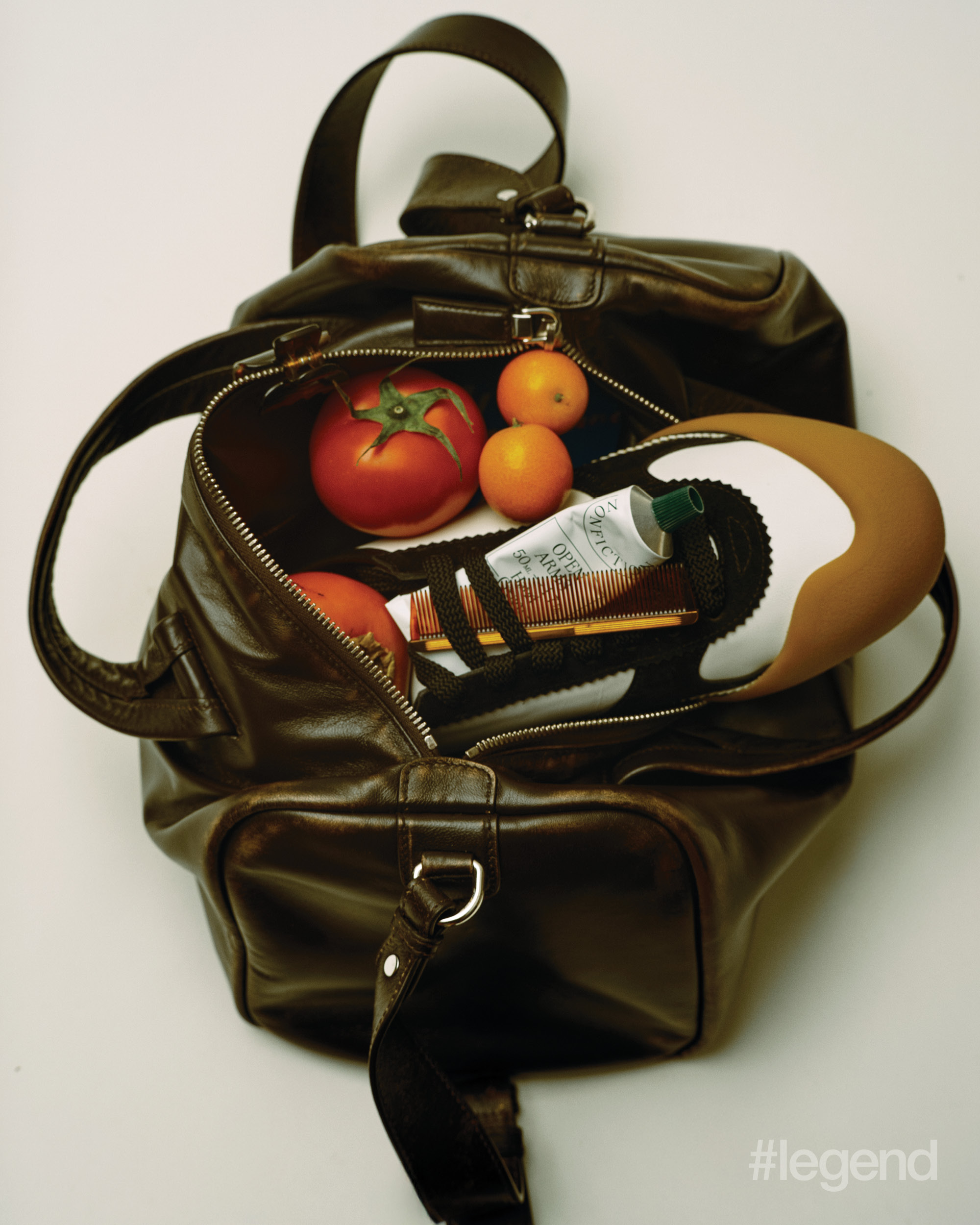 Brown bag _ Prada; Multicolour sneaker _ McQueen; Hand cream _ Nonfiction