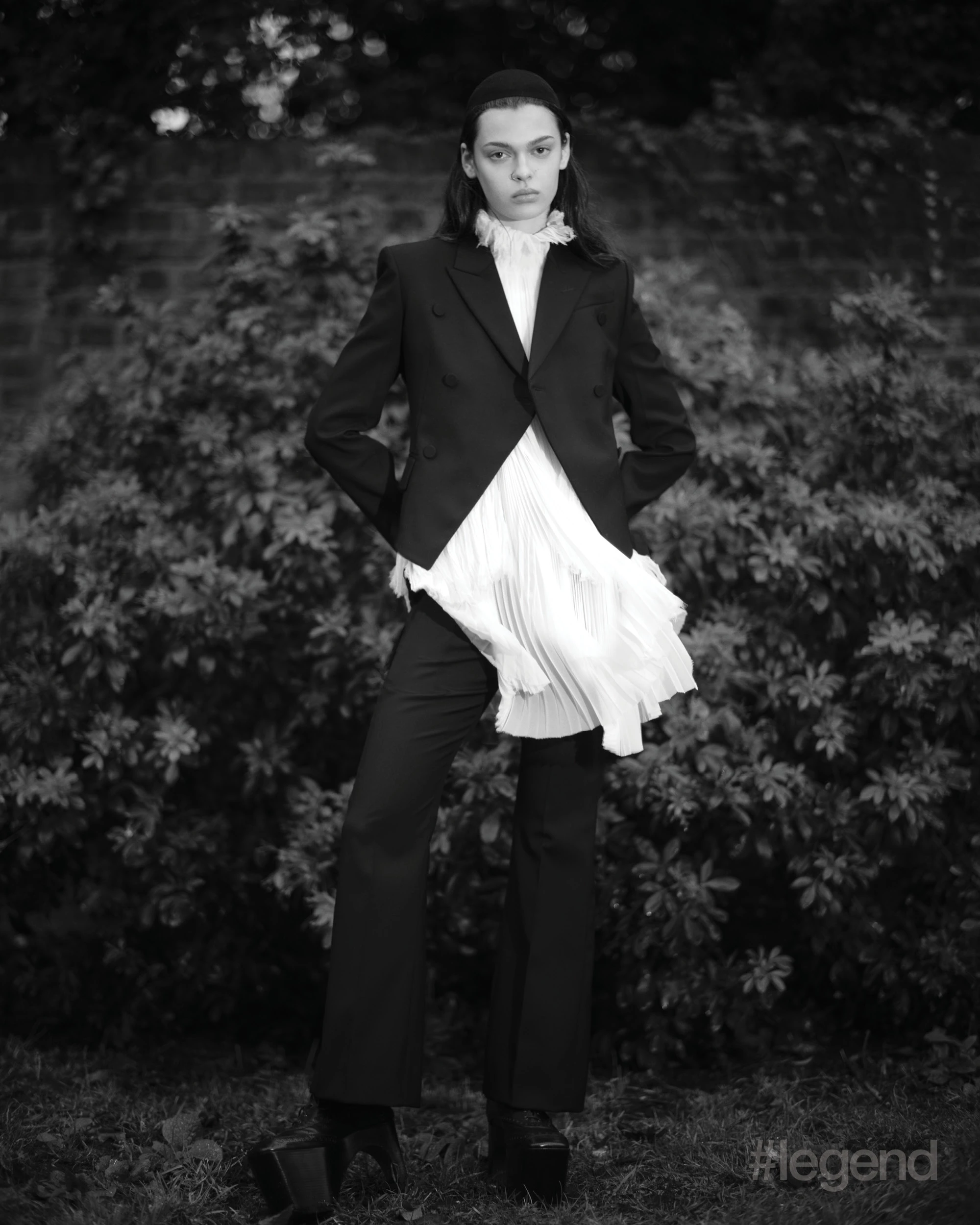 Black suit, white pleated shirt and black platform shoes _ McQueen