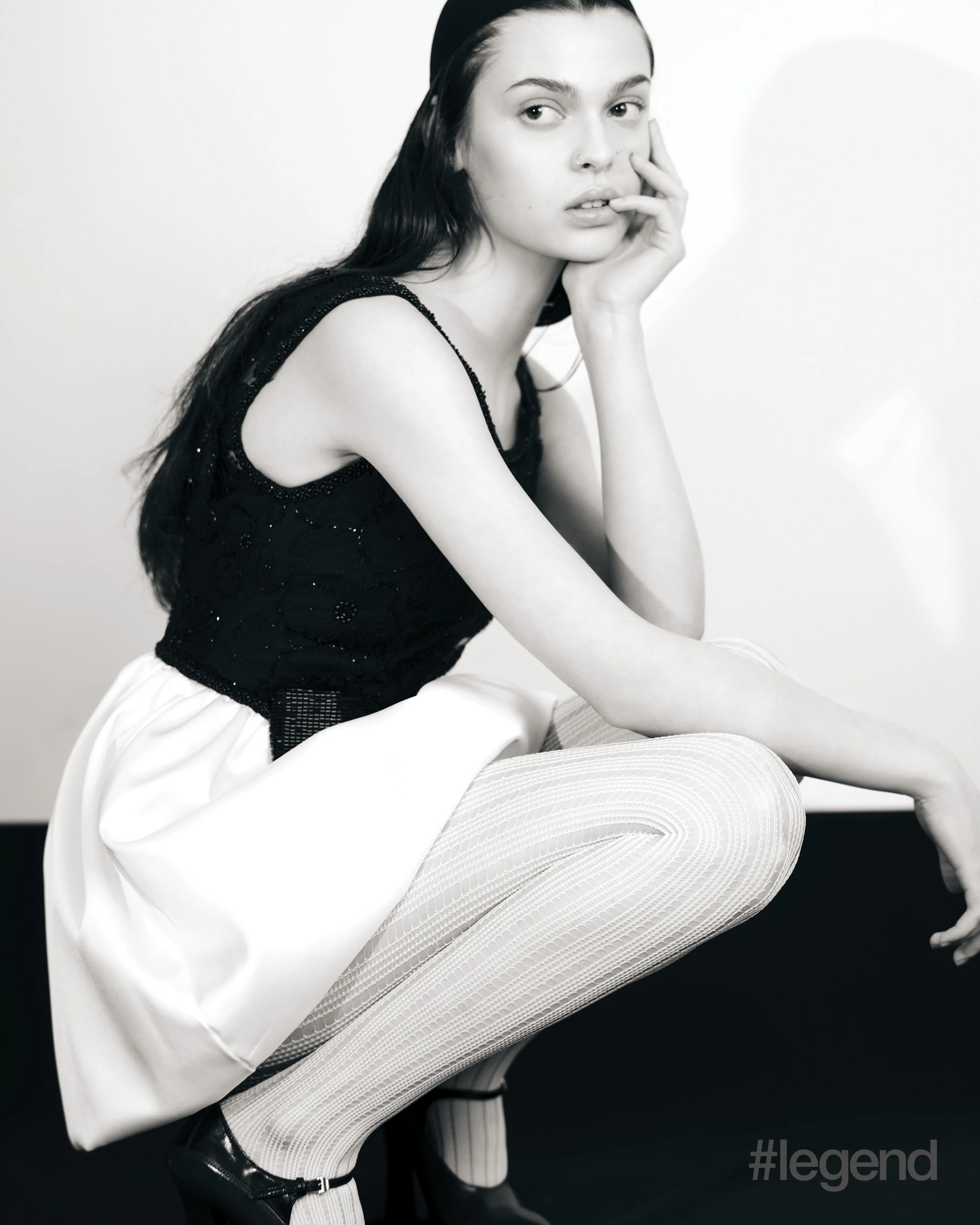 Black and white tulle minidress _ Self-Portrait; White tights _ Wolford; Black Mary Jane pumps _ Prada