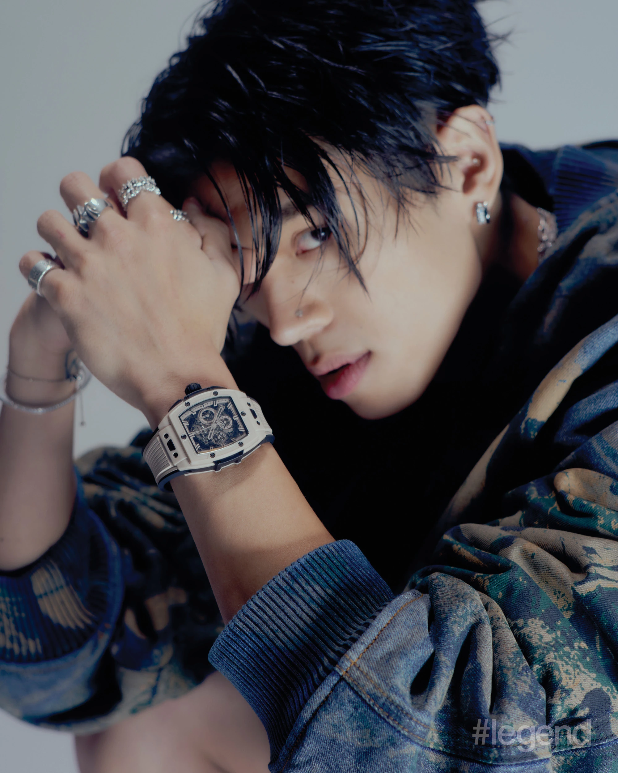 Blue padded printed recycled-denim bomber jacket _ Acne Studios; Silver 925 sterling silver with rhodium coating eternity ring, silver 925 sterling silver with rhodium-plating hexnut and gear earrings _ Midnightfactory; Spirit of Big Bang Beige Ceramic _ Hublot.